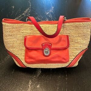 Coach woven straw purse with exterior pocket. Orange detail and orange tags.